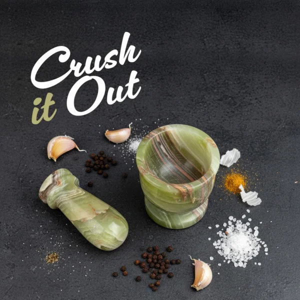 Crush it Out - Mini Crusher mortar and pestle with various spices, garlic, peppercorns, salt and turmeric on dark slate surface